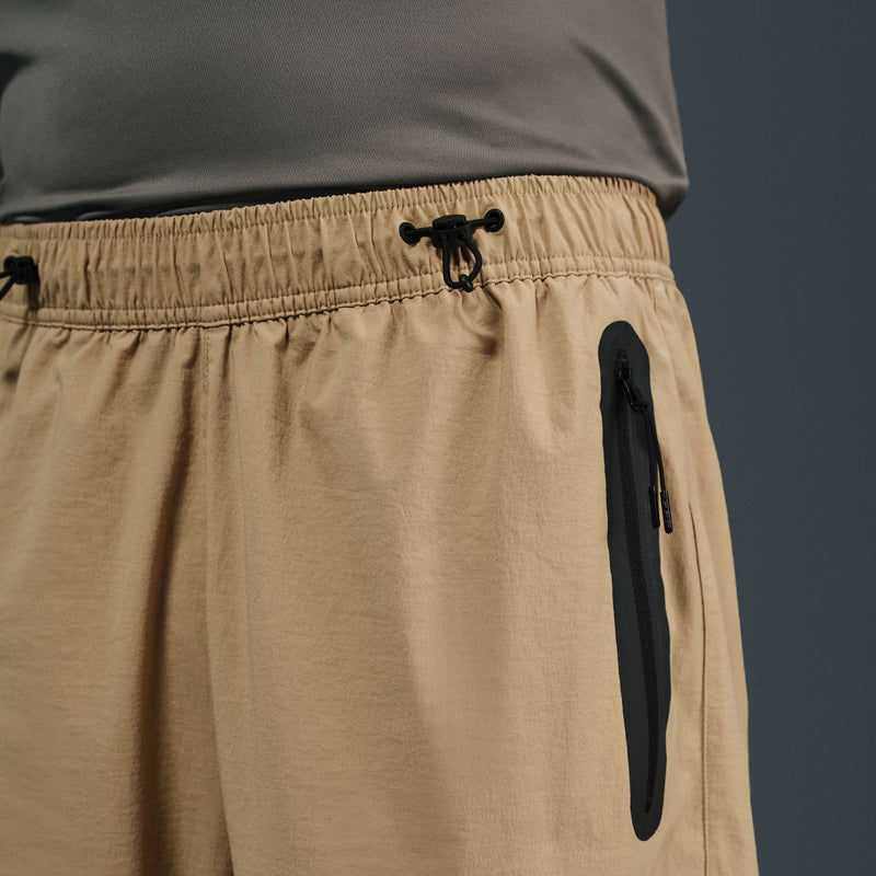 NIKE TECH WOVEN OVERSIZED PANTS "PARACHUTE BEIGE/PARACHUTE BEIGE/BLACK"