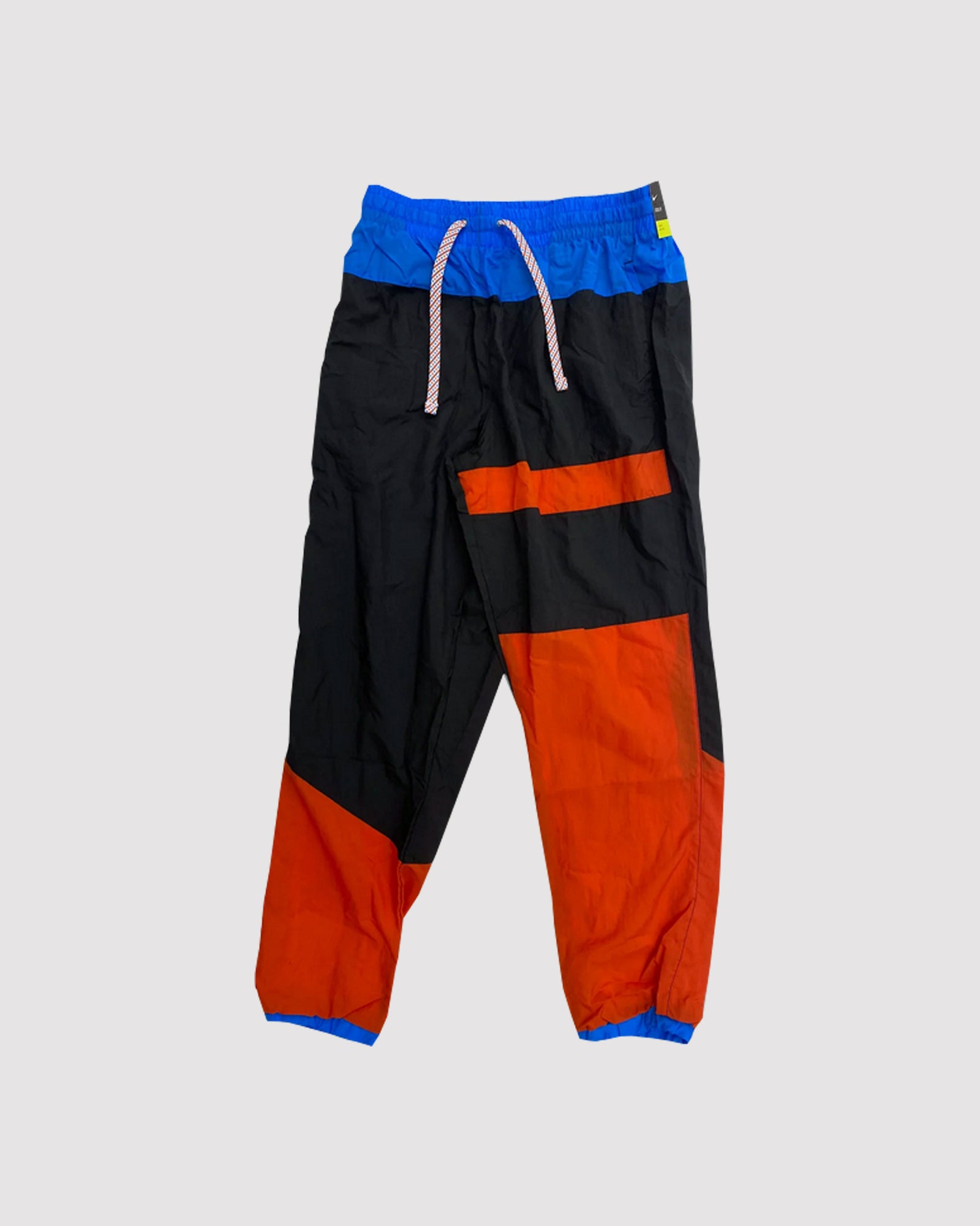 black and orange nike track pants