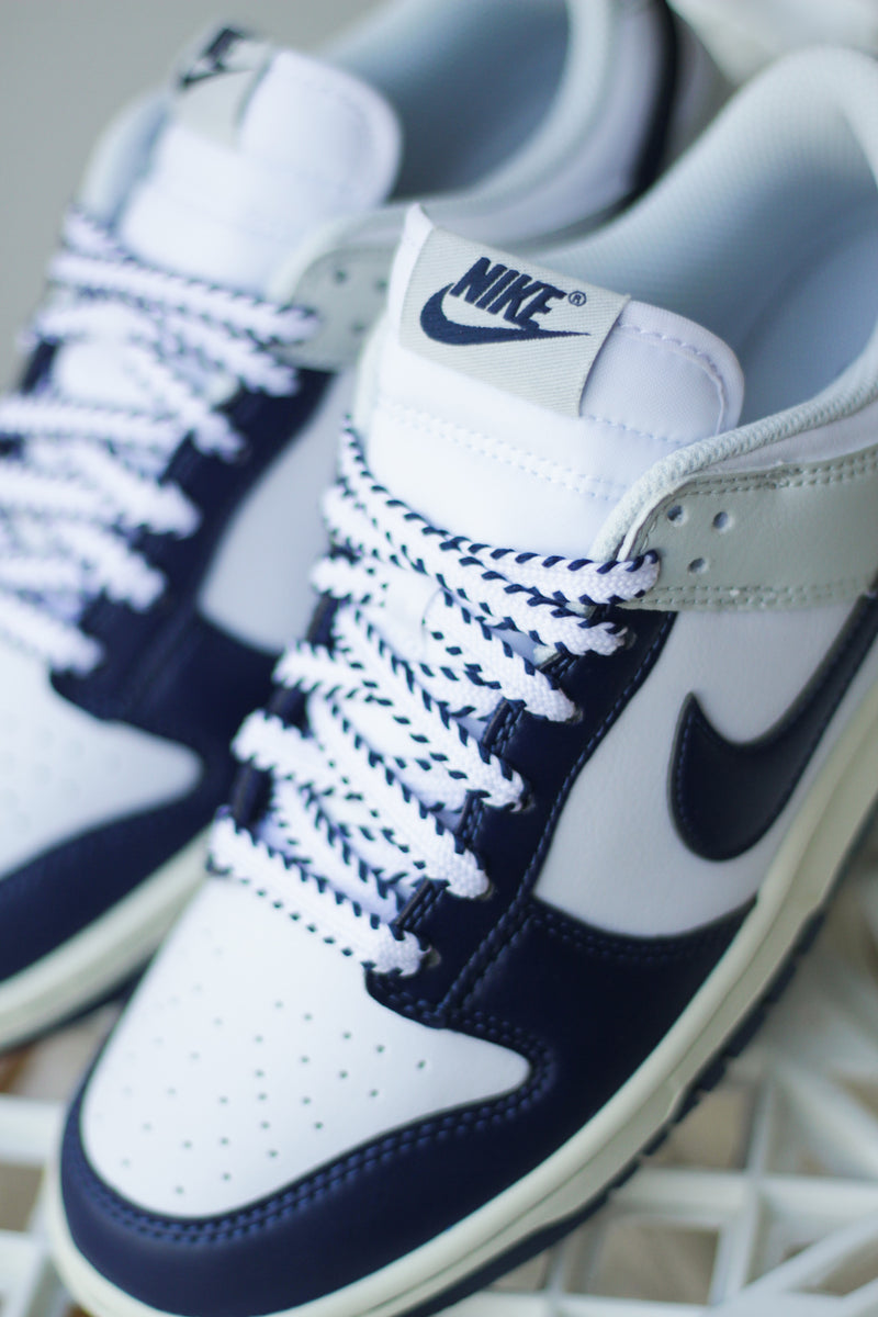 NIKE DUNK LOW RETRO "WHITE/MIDNIGHT NAVY-PHOTON DUST"