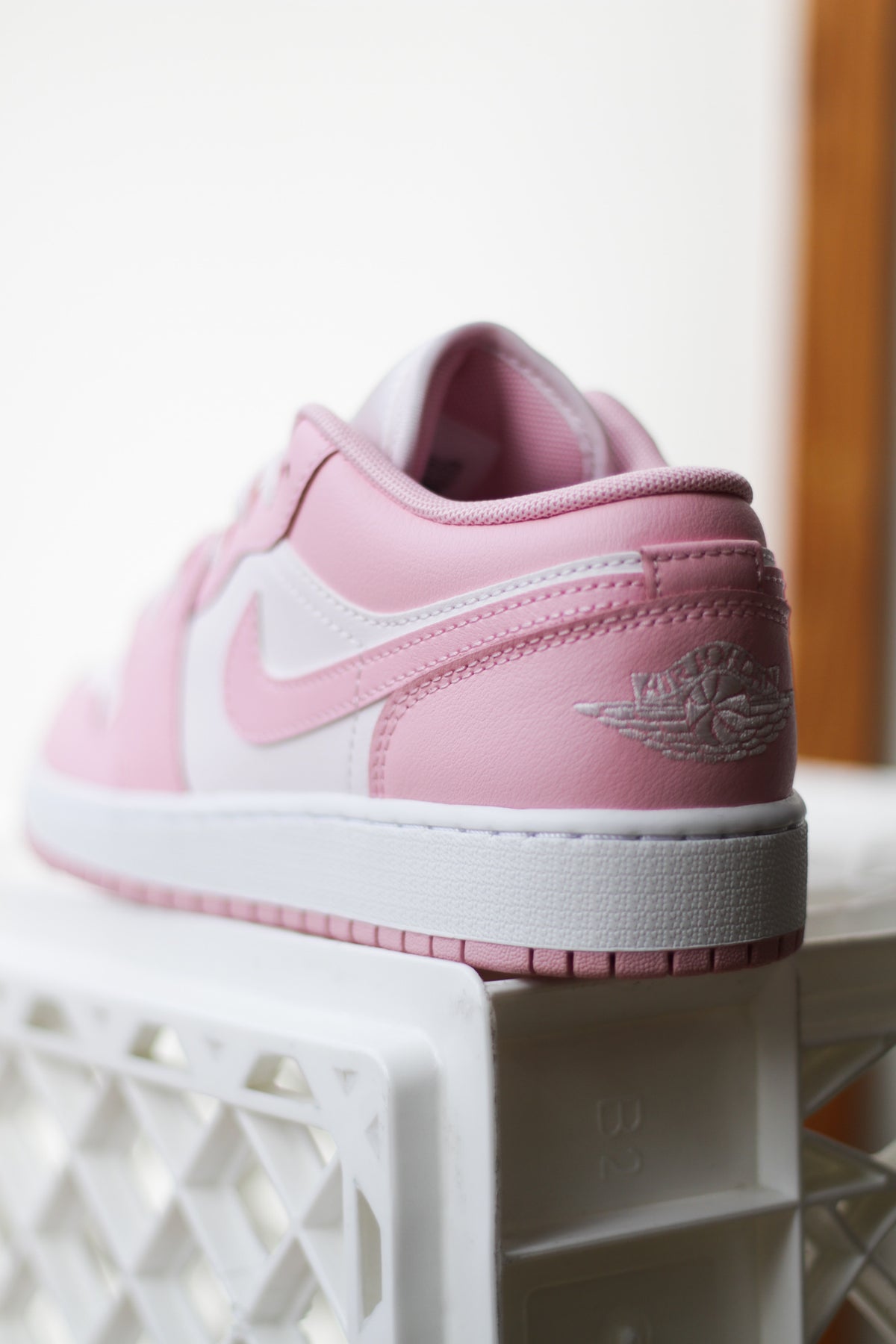 pink and white low jordan 1