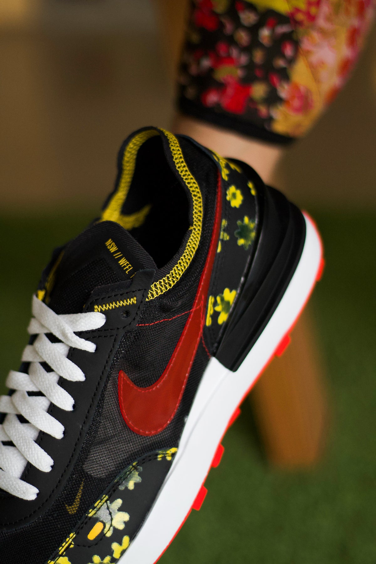 black nike shoes with sunflowers