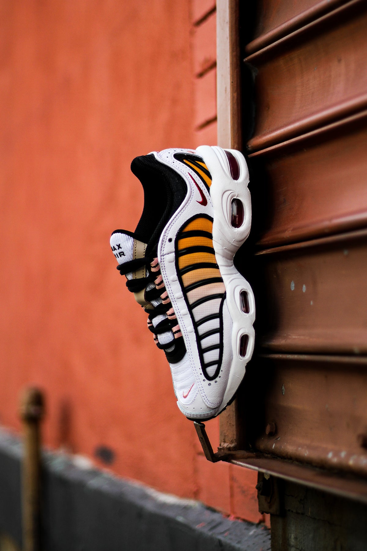 orange nike tailwind